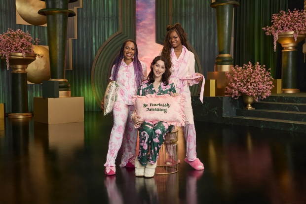 Group of young women wearing Wicked: For Good x Katie Kime pajamas