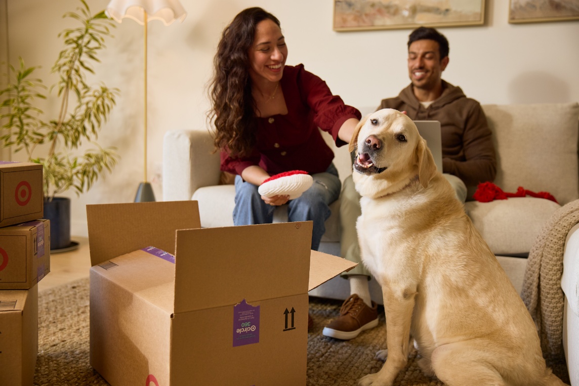 a person and a dog sitting on the floor
