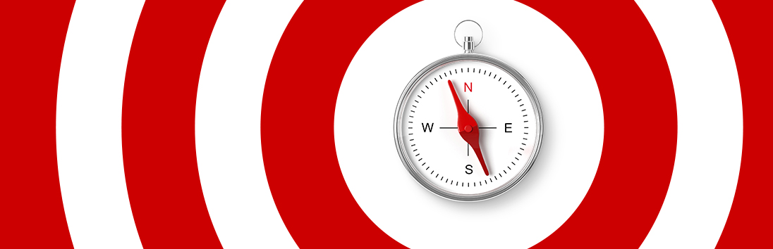 a white clock with red and white stripes