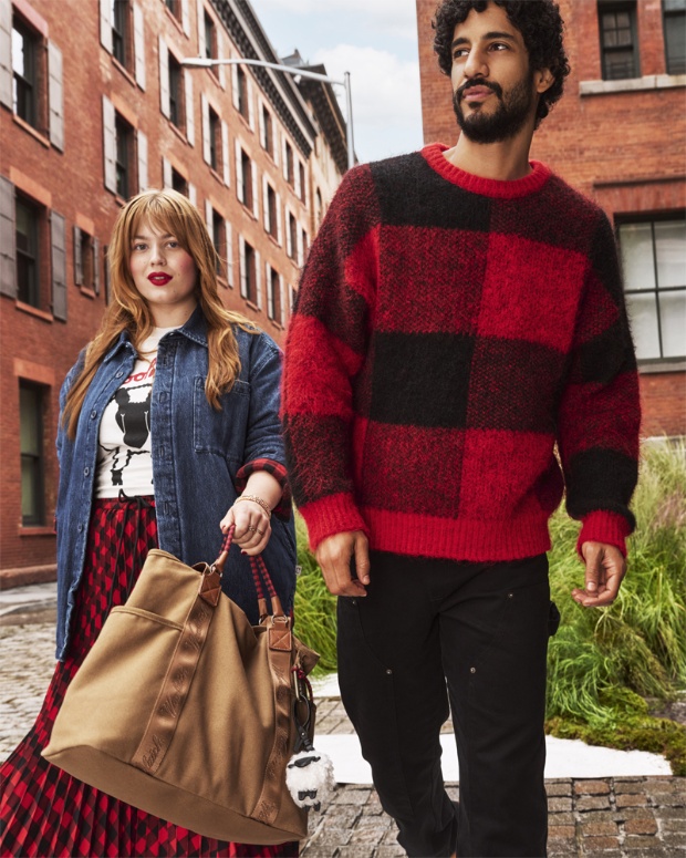 Two models styled in apparel and accessories from the Woolrich x Target collection